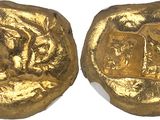 two gold coins with a picture of a man and a woman on them