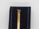 a close up of a gold watch with a chain on it