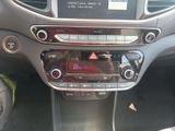a car dashboard with a radio and a steering wheel