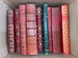a box full of old books sitting on a table