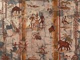 une image représentant une peinture accrochée au mur d'un immeuble, sur laquelle figurent des personnes et des animaux