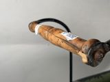 a bike handle with a wooden handlebar attached to it