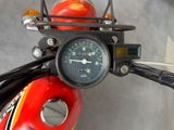 a close up of a motorcycle with a speedometer on it ' s handlebar