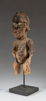 a close up of a statue of a person on a stand