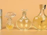 three different types of perfume bottles on a table