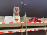 many boxes of beer on the shelves in the store