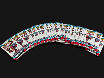 several playing cards are stacked on top of each other on a black background