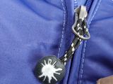 a close up of a zipper on a blue jacket