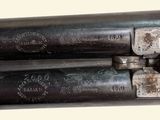 these are two guns that are sitting side by side on a table