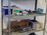 a shelf with various tools on it in a room
