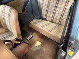 a dirty seat in the back of a car