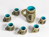 a group of cups and mugs arranged in a circle