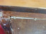 a wooden cabinet that has been painted brown