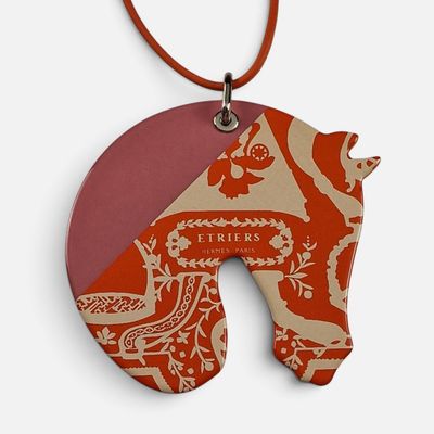 a picture of a necklace with a picture of a horse