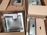 many boxes of different types of kitchen appliances in this room