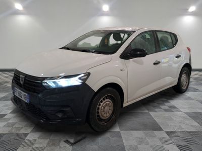 the white car is parked on a checkered floor in a room