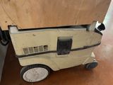 a small toy truck that is sitting on the floor