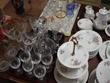 a table with a lot of dishes and glasses on it
