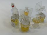 three small glass figurines that are sitting on a table