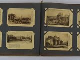 an old photo of a book with pictures of buildings and people