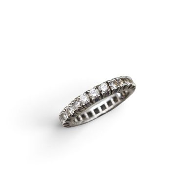 a close up of a diamond ring on a white background
