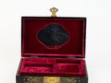 a black and red box with a mirror inside of it