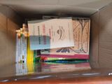 a box full of books sitting on top of a table