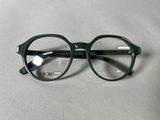 a pair of glasses sitting on a white surface
