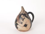 a black and white vase with a nude man on it