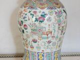 a vase that is sitting on a stand on the floor