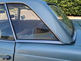 an image of a car with a dog in the passenger seat