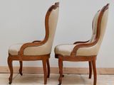 pair of antique french style chairs with leather upholstered seats
