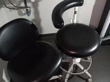 two black stools sitting next to each other in a room
