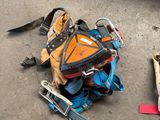an image of a pile of luggage and tools on the ground