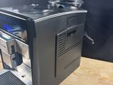 a coffee machine that is sitting on a wooden table