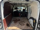 a white van that is parked in a lot