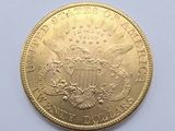an image of a gold coin on a white surface