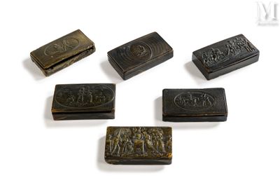 six pieces of carved metal on a white surface with a white background