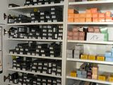 a room with a lot of shelves and bins on it