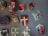 a lot of badges that are on a table