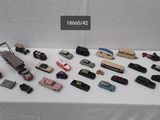 a lot of toy cars that are on a table