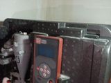 a machine that is sitting in a room next to a wall