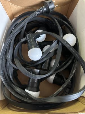 a box with a bunch of black and white hoses in it