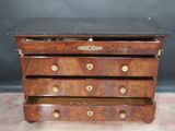 an antique chest of drawers with marble top