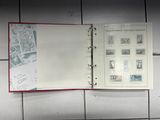 a binder with stamps on it sitting on a tile floor