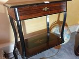 a small table with a drawer on top of it
