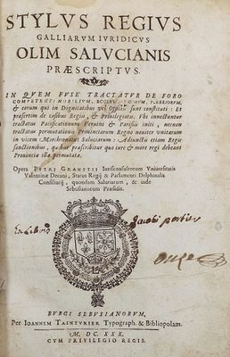 an old book with a picture of a coat of arms on it