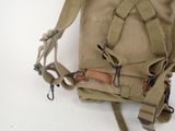 a backpack that is sitting on a white surface