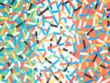 colorful sprinkles are scattered on a white surface
