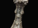 an image of a silver vase sitting on top of a table